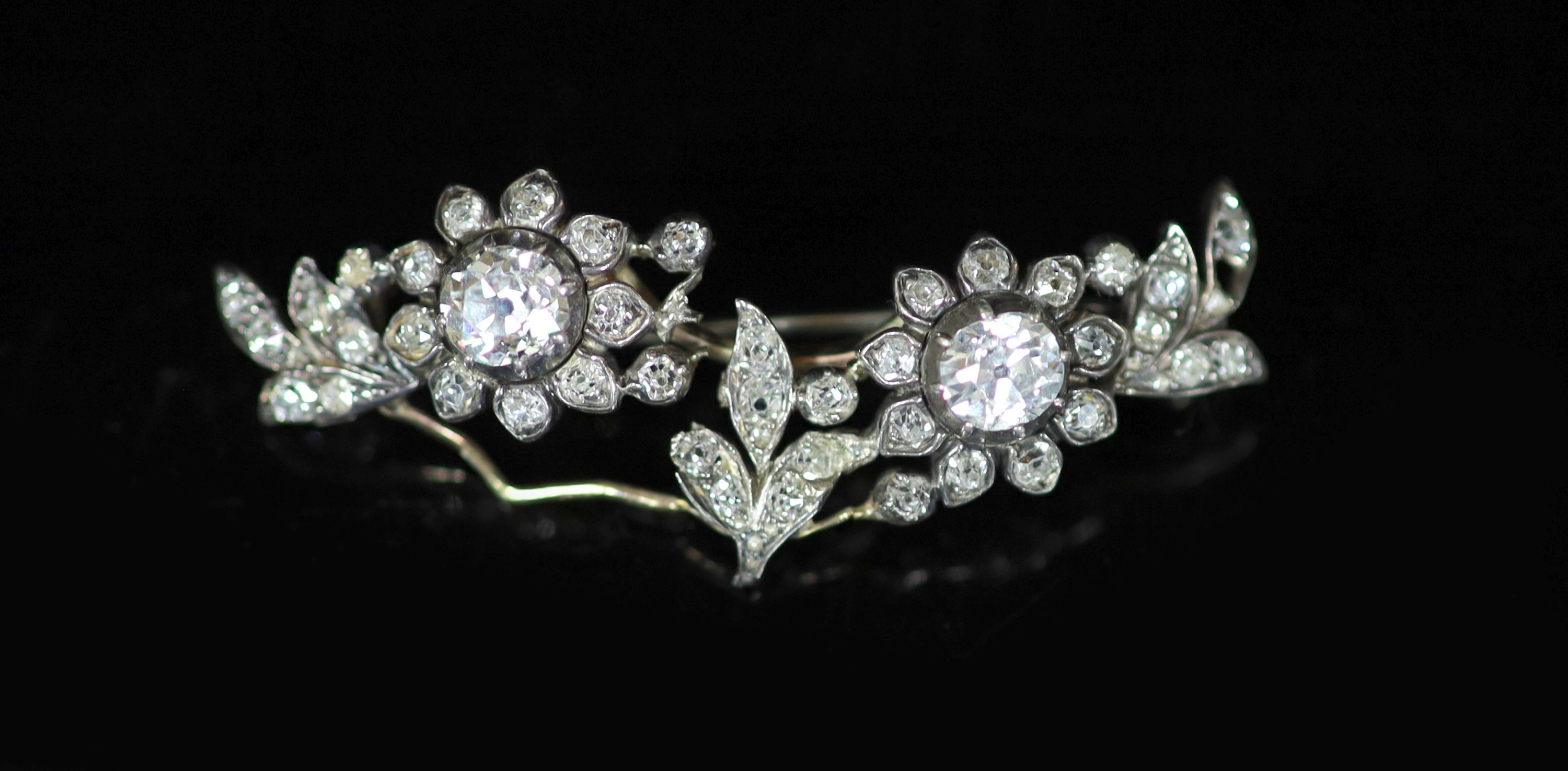 A late Victorian gold, silver and diamond cluster set foliate brooch